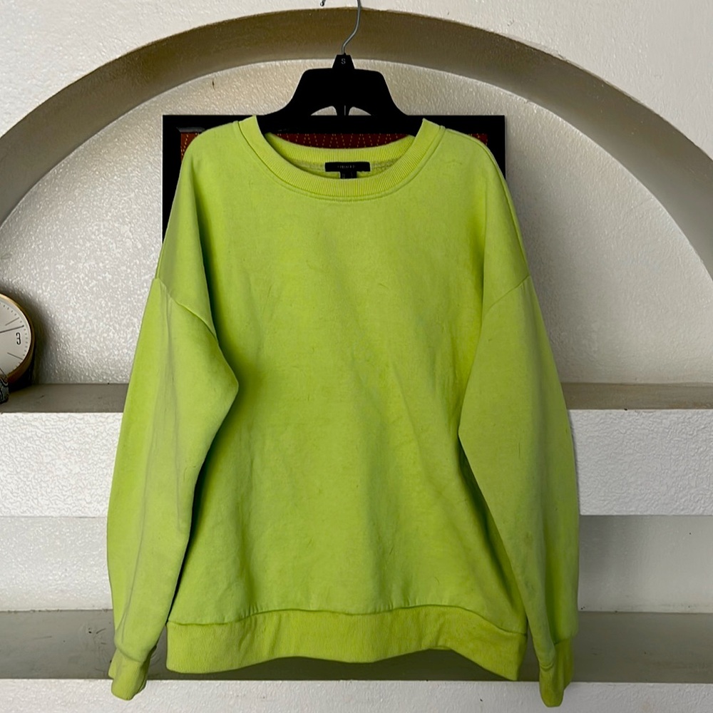 I am selling a neon green light worn crewneck